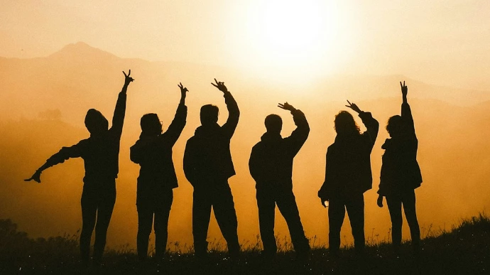 silhouette photo of six persons on top of mountain