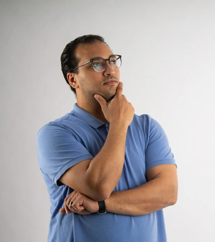 Man with glasses is deep in thought